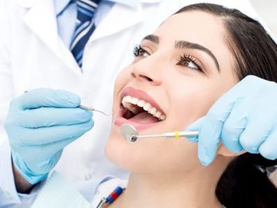 Young female patient receiving dental care